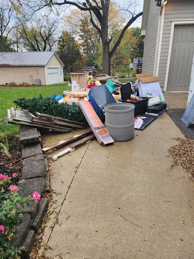 Dumpster being loaded with debris for Residential Dumpster Rental in Chowchilla